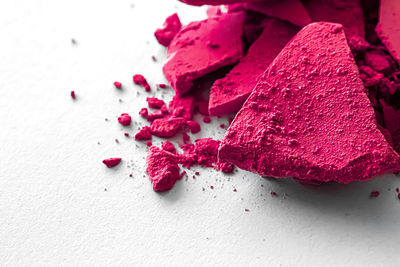 High angle view of pink old blusher on table