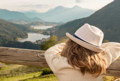 Rear view of woman with hat on mountain