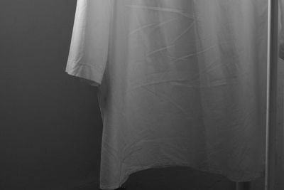 Rear view of woman standing at home