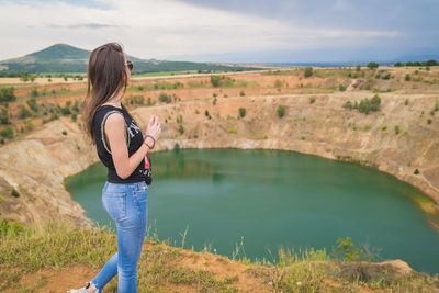 Side view of woman standing in water