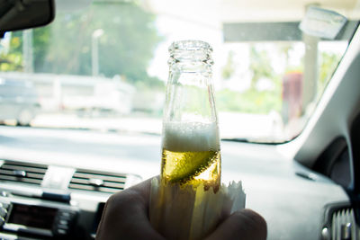 Close-up of hand holding drink