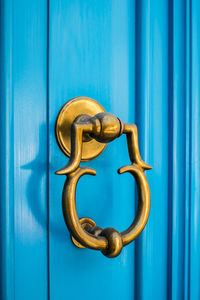 Close-up of blue door knocker