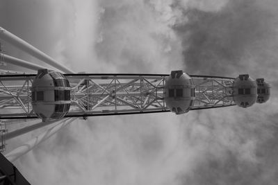 Low angle view of ferris wheel against sky