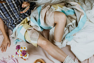 High angle view of woman sleeping on bed