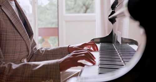 A man is playing piano