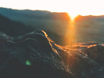 View of volcanic mountain against sky during sunset