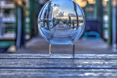 Crystal ball of boats docked at a marina near venetian bay in naples, florida at sunrise.