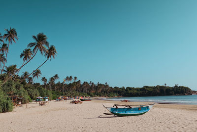 Scenic view of beach against clear sky