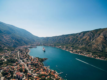 Scenic view of lake against clear blue sky