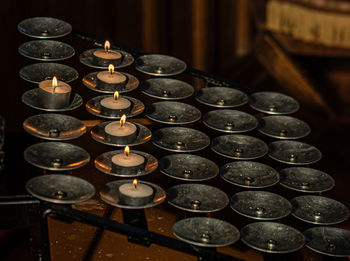 High angle view of tea light candles in building