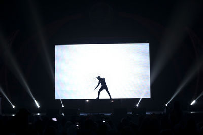 Silhouette people at music concert