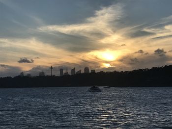 Scenic view of river against sky during sunset