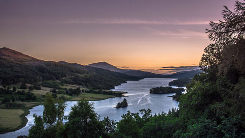 High angle view of river amidst trees against sky