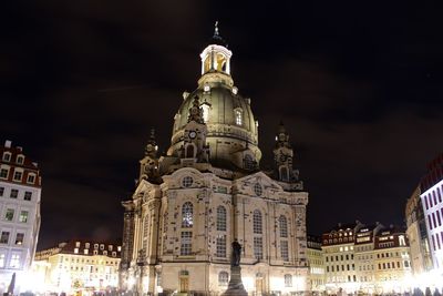 Low angle view of illuminated cathedral against sky at night