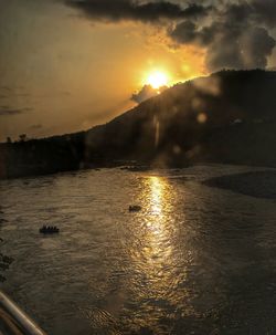 Scenic view of sunset over river