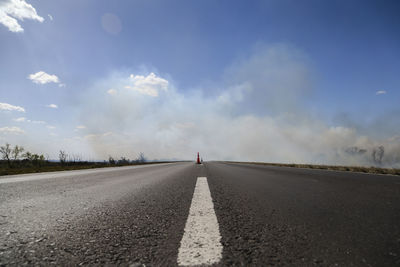 Empty road against sky