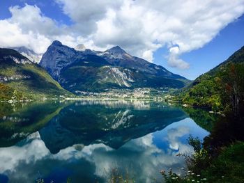 Scenic view of lake and mountains against sky