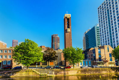 Modern buildings against clear blue sky