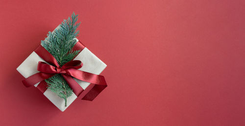 Close-up of christmas decorations on red background