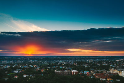 High angle view of buildings against sky at sunset