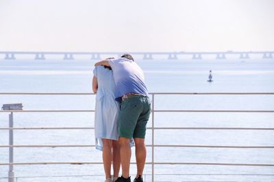 Rear view of couple hugging