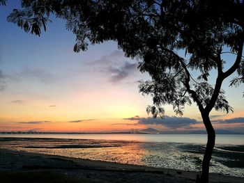 Scenic view of sea against sky at sunset