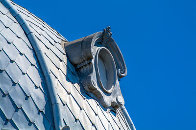 Low angle view of roof against clear blue sky