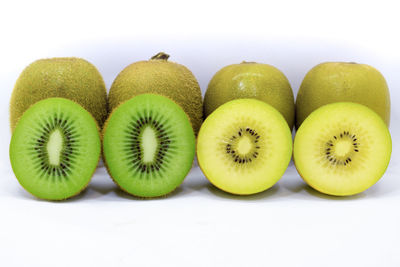 Close-up of fruits over white background