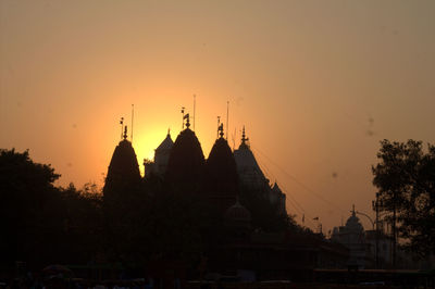 Silhouette of temple against sky during sunset