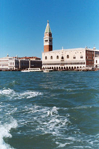 View of sea against buildings