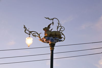 Low angle view of street light against sky