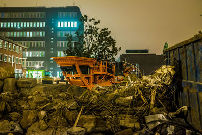 Bulldozer against built structure