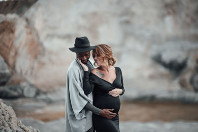 Rear view of couple standing outdoors