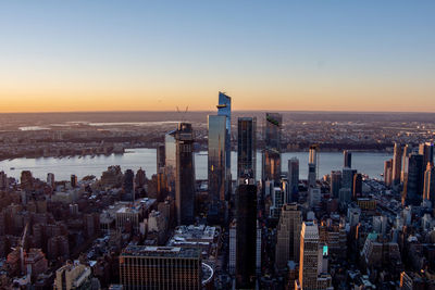 High angle view of cityscape against clear sky during sunset