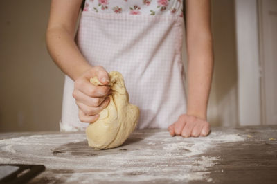 Midsection of woman preparing food