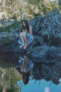 Portrait of woman on rock