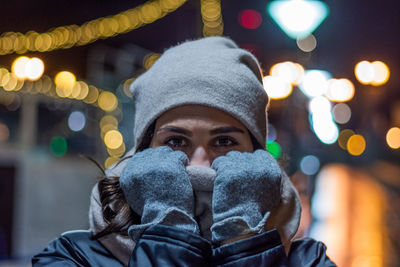 Close-up portrait of woman in snow