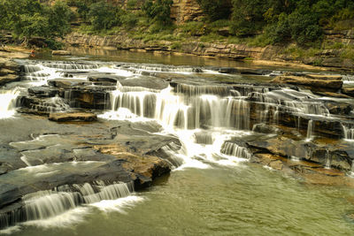 Scenic view of waterfall in forest