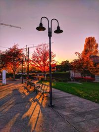 Street light in city against sky