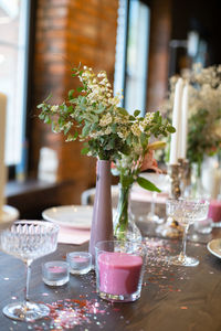 Flowers in glass on table