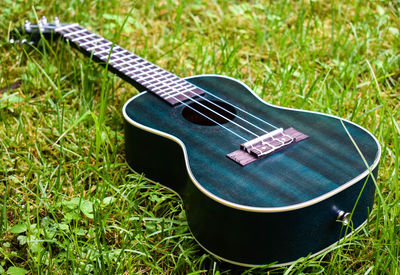 High angle view of guitar on field