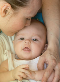 Portrait of cute baby mother