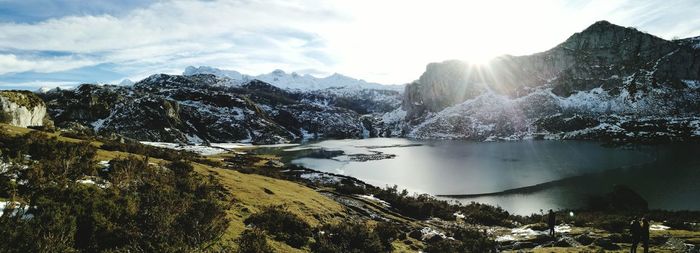 Scenic view of lake and mountains against sky