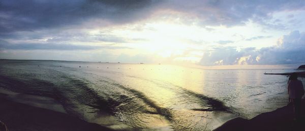 Scenic view of sea against sky at sunset