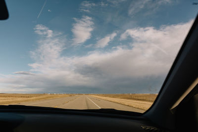 Road seen through car window