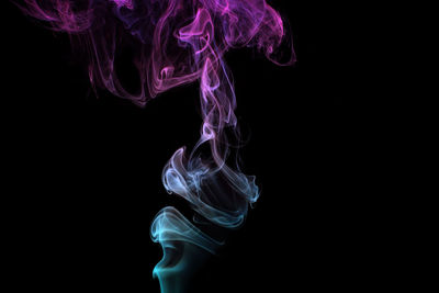 Close-up of smoke against black background