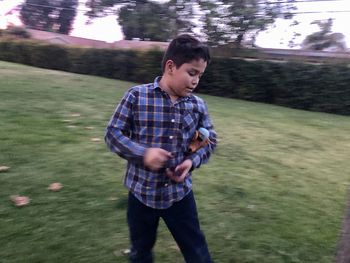 Young man standing on field