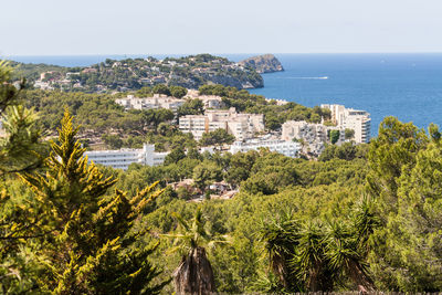 Panoramic view of townscape by sea against sky