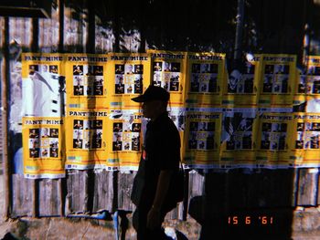 Rear view of man working at night