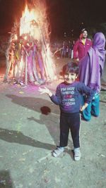 Full length portrait of boy standing outdoors